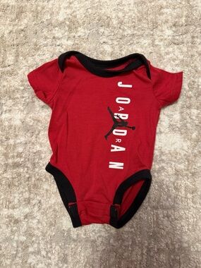 Jordan Red Bodysuit with Black Trim and Jumpman Logo size Newborn